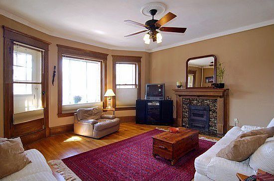 Large sun filled living room excellent for entertaining with gas fireplace