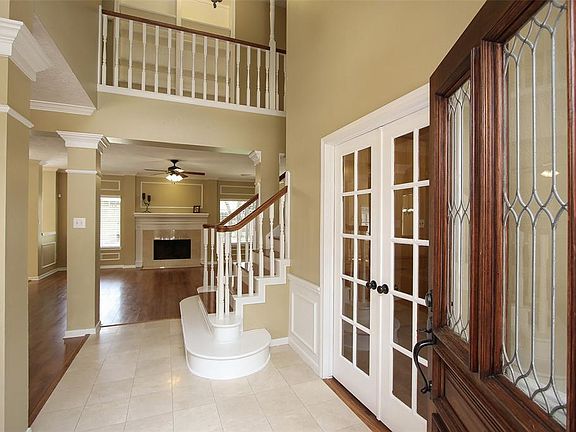 Come inside the 2-story foyer and take a look around. There's neutral paint all through the living areas and bright white molding and woodwork.