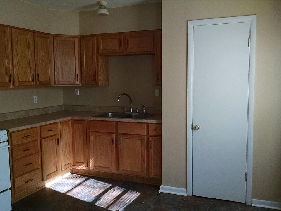 Kitchen showing door to pantry