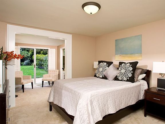 Master Bedroom opening up to sprawling lawn out back