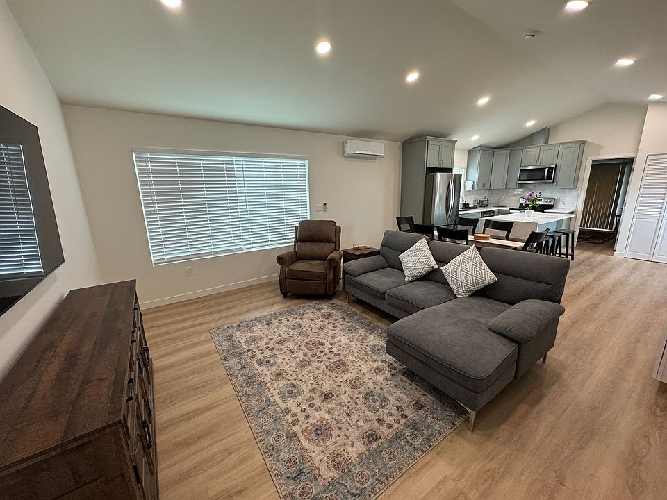 Open spacious floor plan with vaulted ceilings and large windows