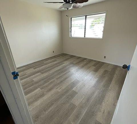 2nd bedroom - luxury vinyl flooring and ceiling fan.
