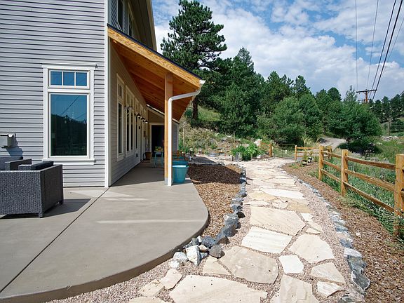 Wrap around porch next to creek