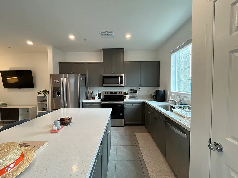 Refrigerator, Microwave, Electric Stovetop, Oven, and Dishwasher