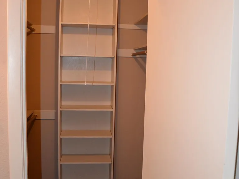 Walk in closet in primary bedroom