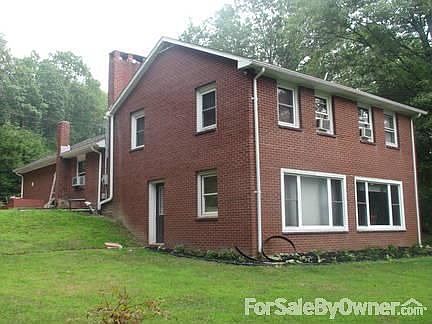 Back and side : View of bay windows and back door into living room