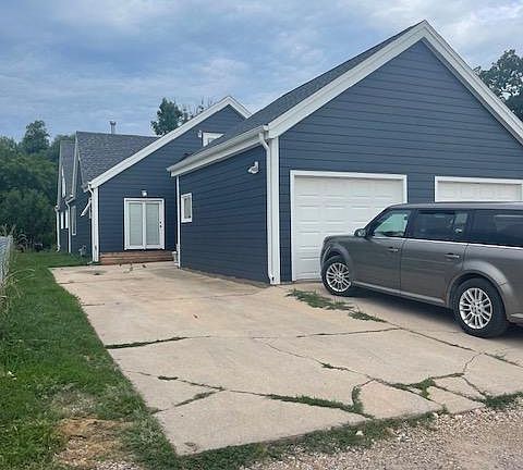 Parking Spot is located on empty cement pad. You may also park in the front of the house.