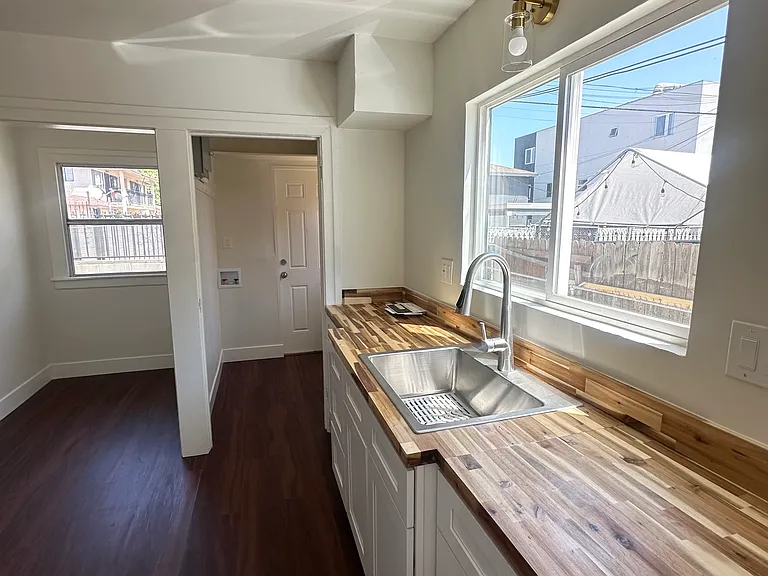 Spacious kitchen & dining area with ample natural lighting.