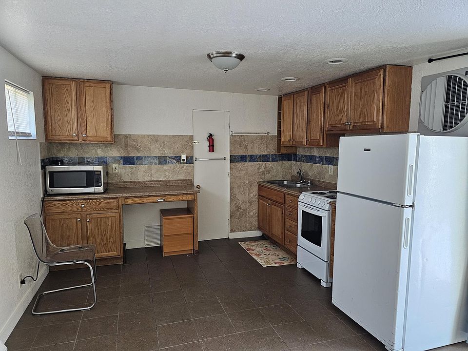 Kitchen ,electric stove, new tile, microwave,desk area