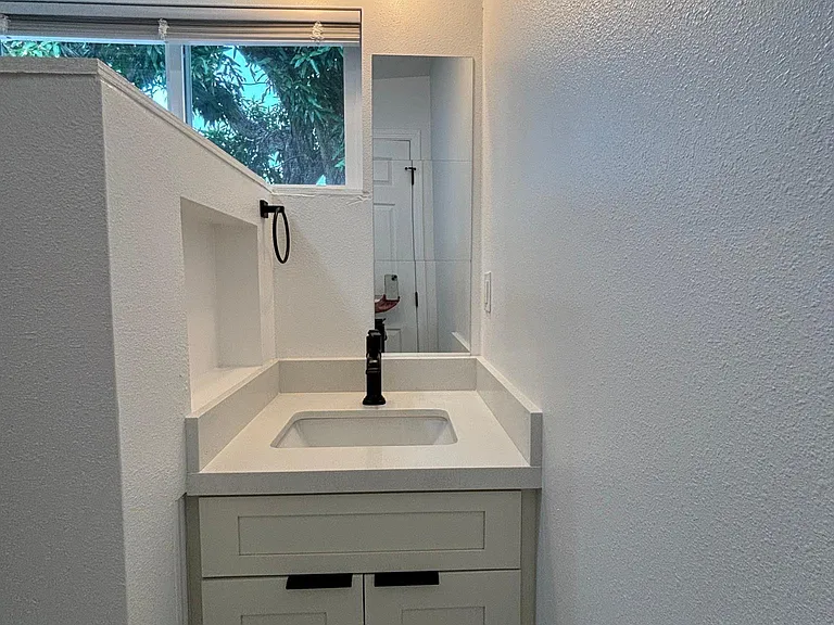 Vanity with Quartz counter and storage niche