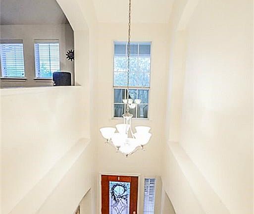 View from the upstairs interior to the entryway.  Modern and elegant.