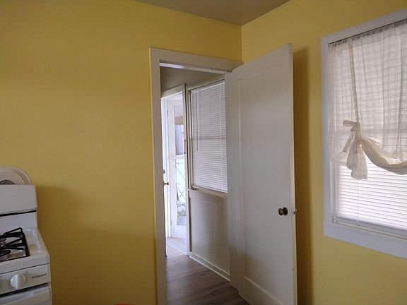 Kitchen area looking out the laundry room door to the patio