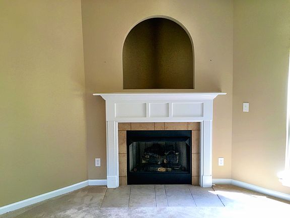 Fireplace with TV arched cove above