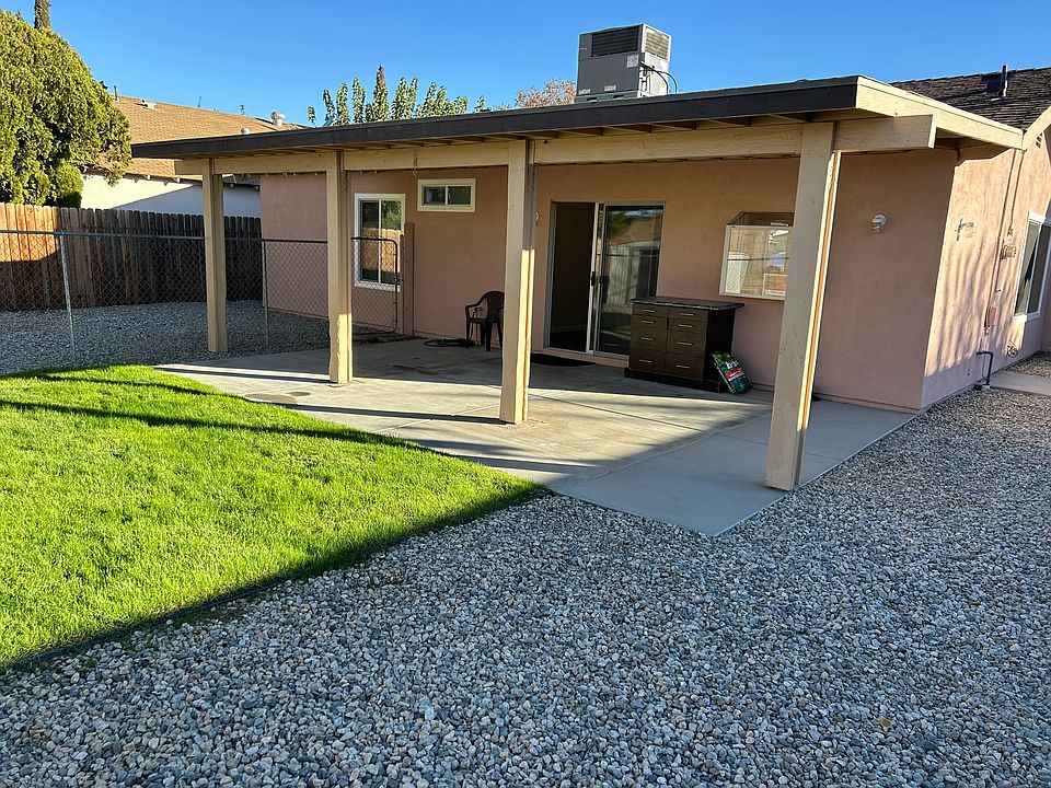 BIG BACK YARD PATIO. SMALL GRASS AREA.