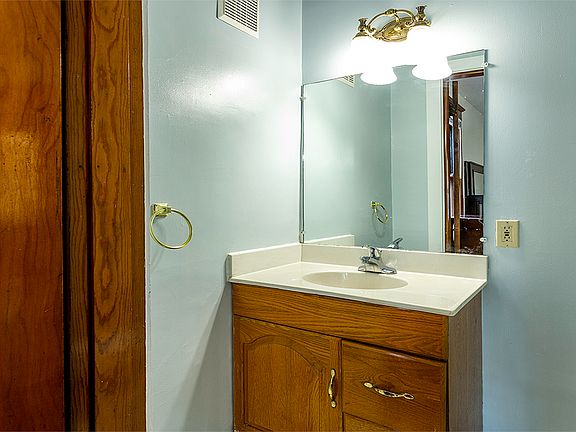 vanity and toilet inside of Room "C"