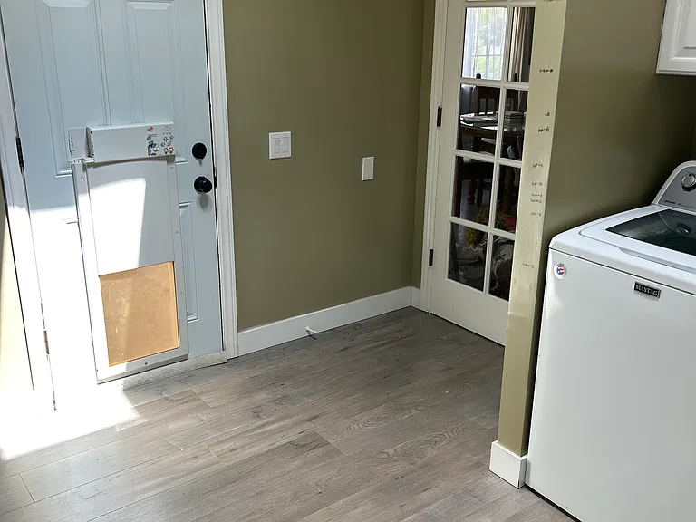 Laundry room door (dog door) to back yard.