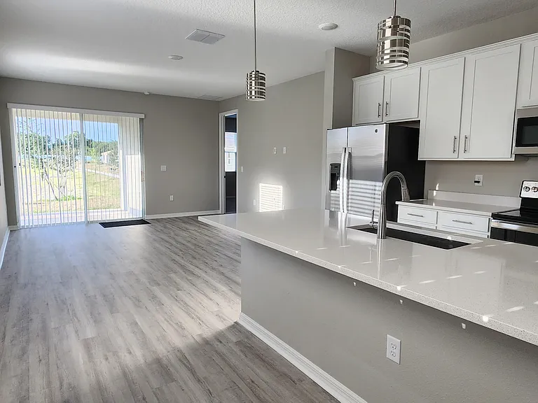 Large Kitchen Island with beautiful pendant lights