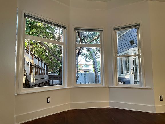 The bay window in the bedroom looks out to the deck and the yard.