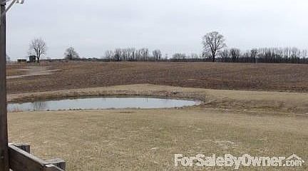 view of pond off back porch