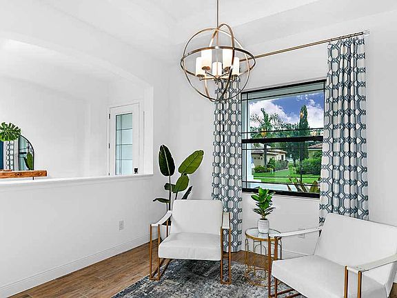 Joyce model home formal living room and foyer by William Ryan Homes Tampa