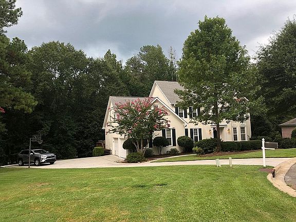 Front with 2 garage doors