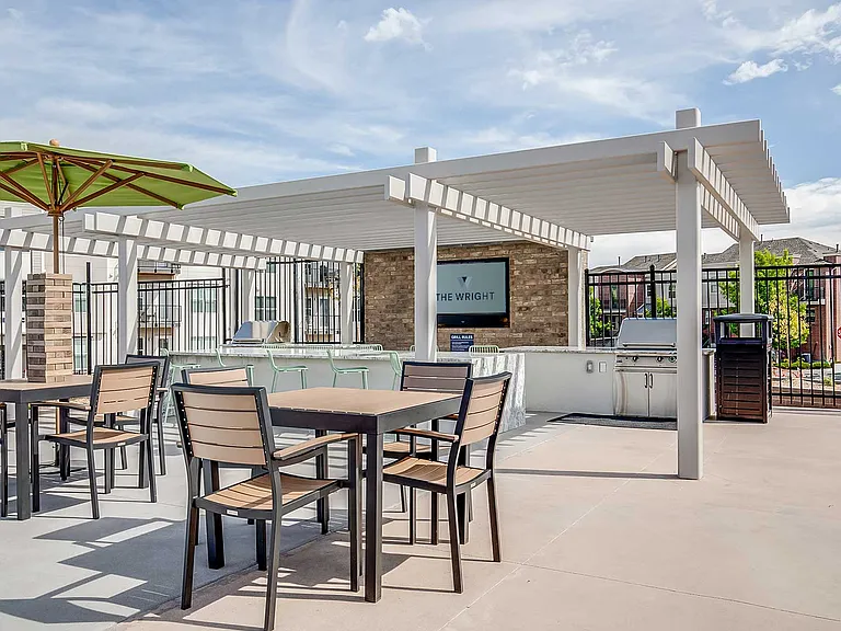 Outdoor gathering spaces at The Wright feature grilling stations, shaded seating, and comfortable lounge areas designed for connection and everyday enjoyment.