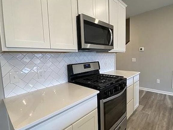 Actual home, tile backsplash and Silestone quartz countertops.