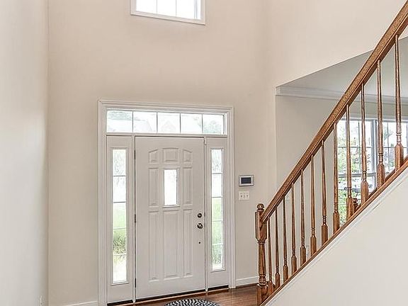 Dramatic 2 Story Foyer with New Hardwoods