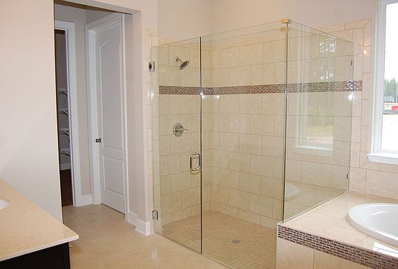 The Redington Owner's Bath with glass shower and tub