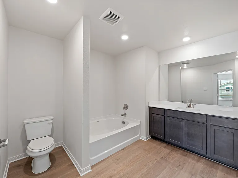 The master bathroom has a garden tub.
