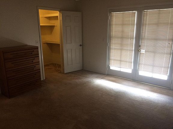 master bedroom with walk-in closet
