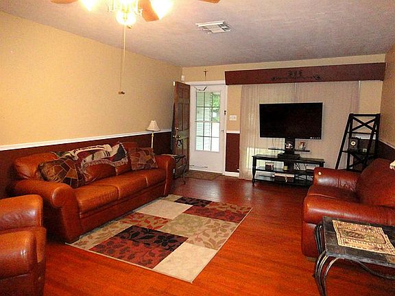 Den with natural wood floors