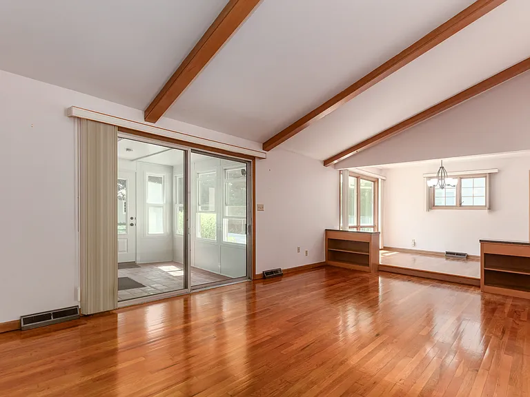 Living room view with pristine natural hardwood floors