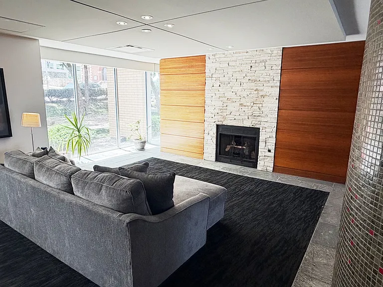 Elegant fireplace lounge with floor-to-ceiling windows_an upscale retreat right in your building