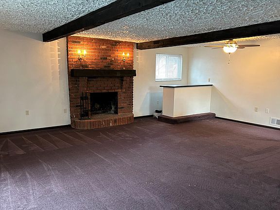 Living /Dining Area, beamed ceilings, ceiling fans.