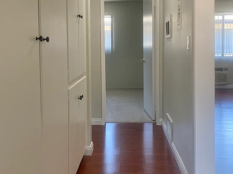 View down the hallway to the south (secondary) bedroom
