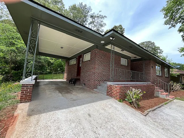 Covered front porch and one-car carport