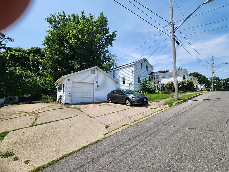 Garage for storage and off street parking for 4+ comes in handy when city bans on-street parking mid-winter for plowing.