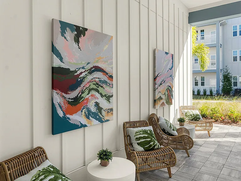 Experience serene outdoor living with artful touches and comfortable seating.