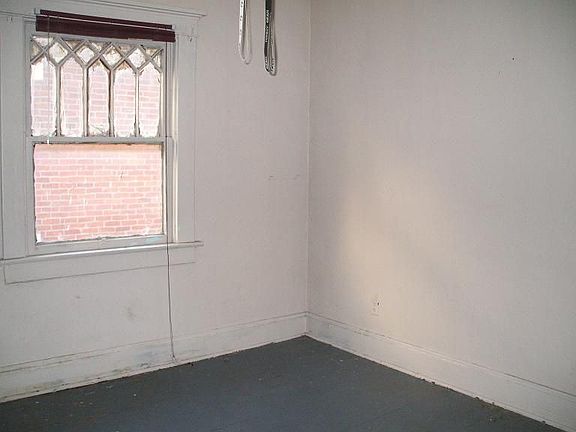 Back bedroom with access to upstairs enclosed porch.