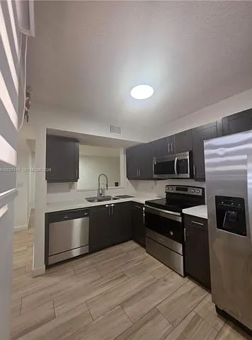 15711 SW 137th Ave #101 — Photo 1