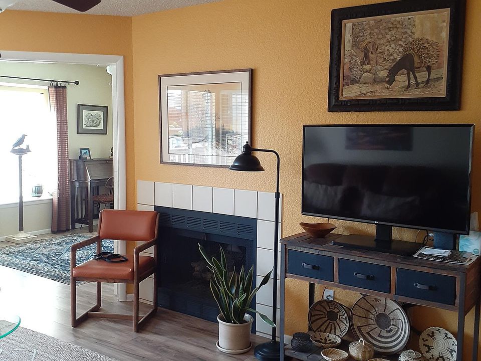 Fireplace and view of office/BR2