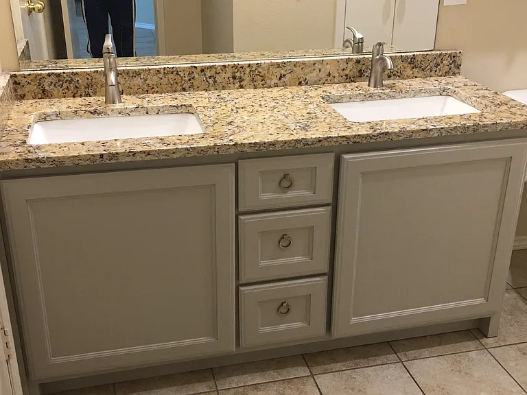 New cabinet, sinks, faucets, and countertop in main bath*