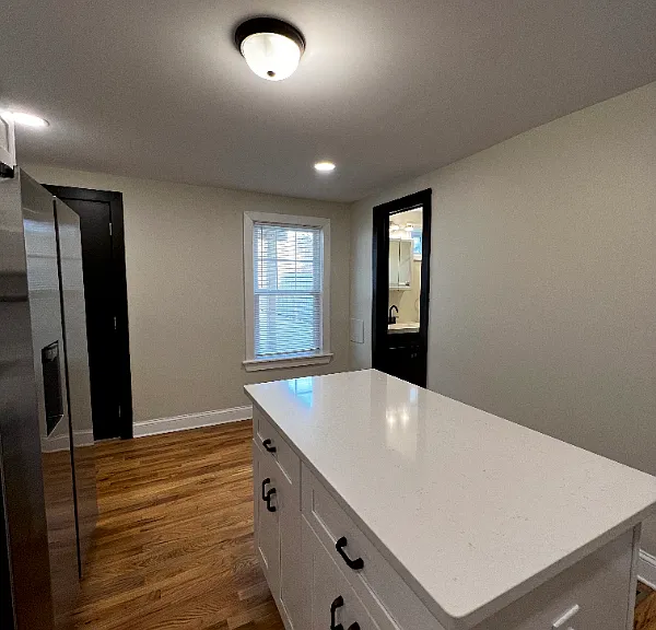 Beautiful kitchen with gas stove, mounted microwave, and dishwasher.