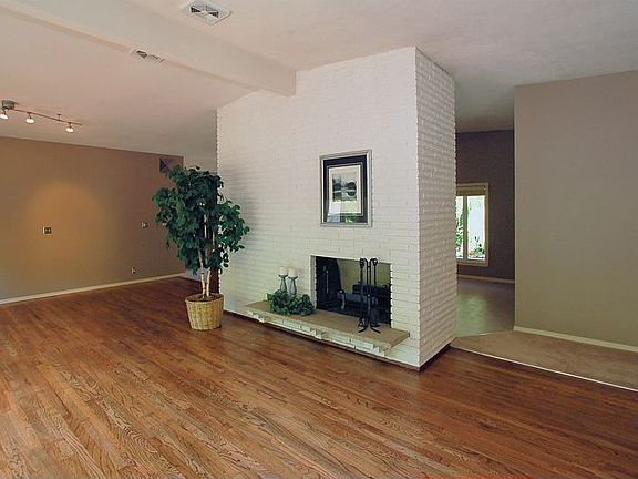 Living room with vaulted ceilngs and hardwoods