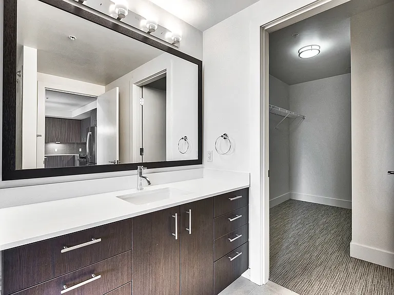 Our homes feature quartz counters, framed mirrors and upgraded lighting