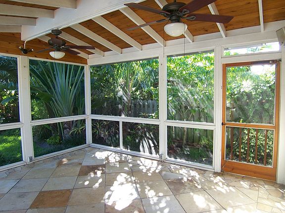 Custom built patio. removable screens for ease of storms prep. Brazilian slate