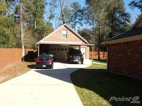 10944 Forest Creek front of detached garage with carport
