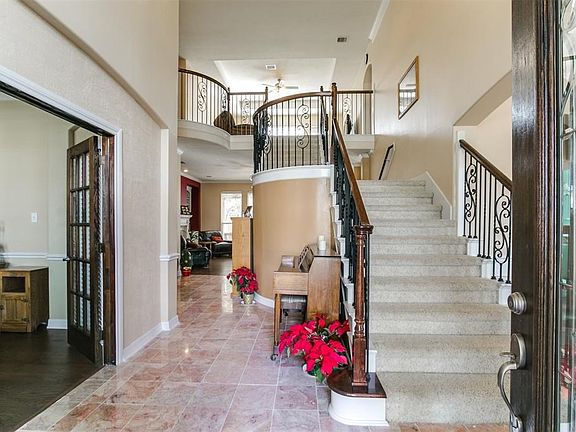 Gorgeous marble entry and grand staircase.