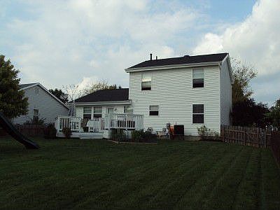 Fenced in Back Yard with Two-Tiered Deck